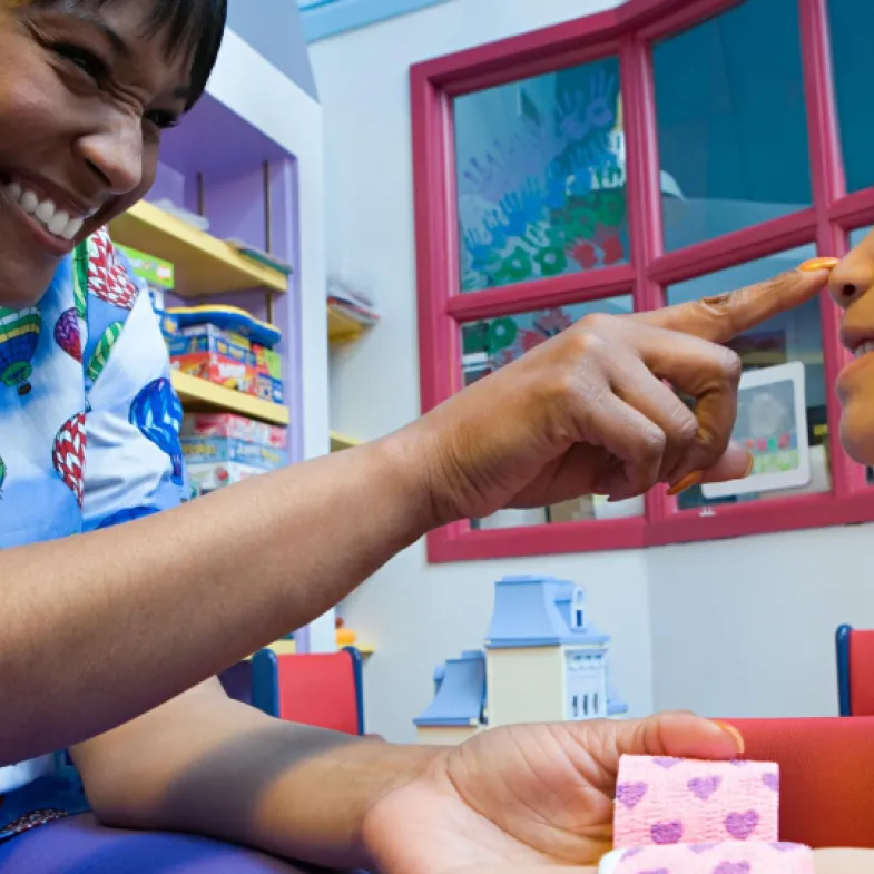 Doctor interacts with young patient