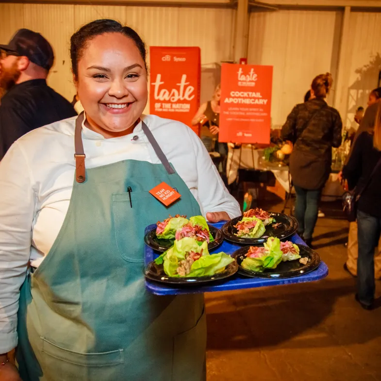 Chef Evelyn Garcia serving 
