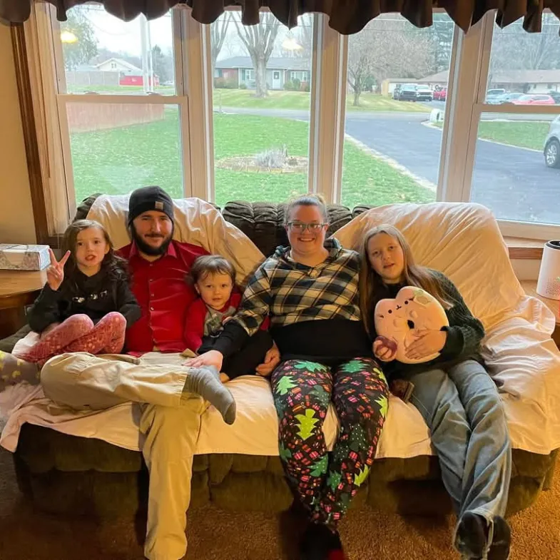 White family 2 adults and 3 kids on couch
