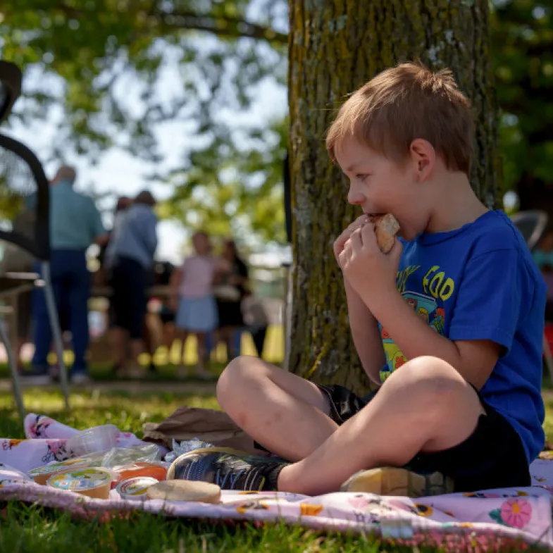 White Kid Eating Outside