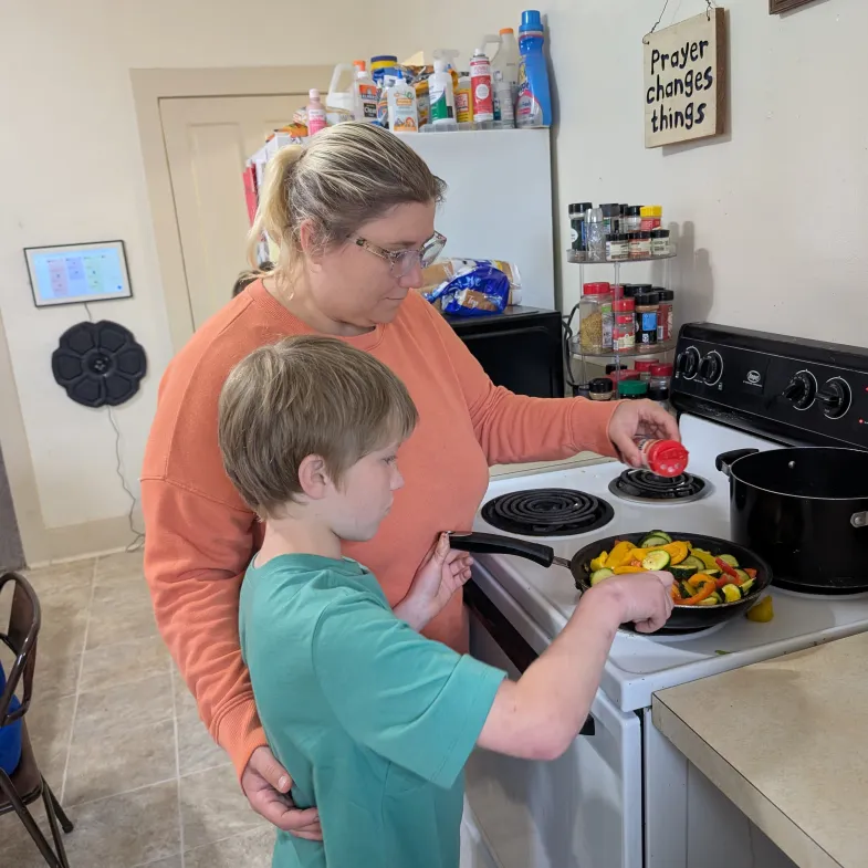 Family cooking at home (white mom and son)