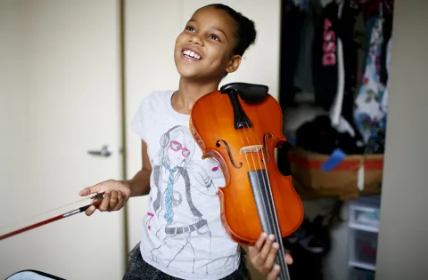 Girl holding violin