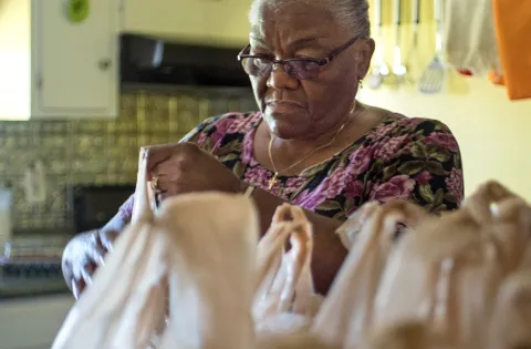 Grandma packing lunches