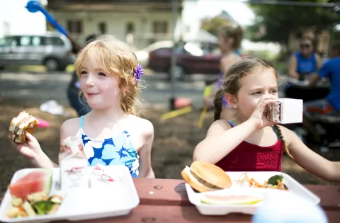 Two girls at a summer meals site