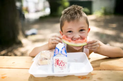 kid eating watermelon