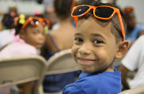 Boy in school with sunglasses