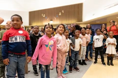 Kids look excitedly at Stephen and Ayesha Curry.