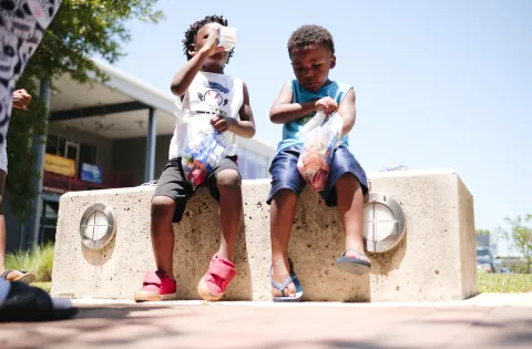 Two young boys on a wall in Texas