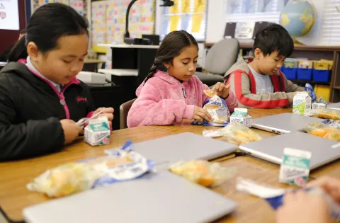 Kids eating breakfast