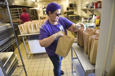 Volunteer prepares meals for hungry kids during coronavirus closures