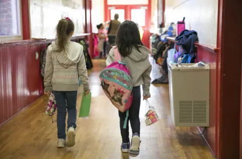 Kids walking in school hallway during COVID crisis