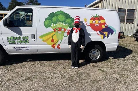 Man in front of a van