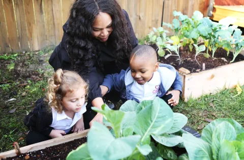 Woman with kids in the garden