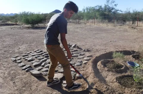 Young man working in the garden in Arizona