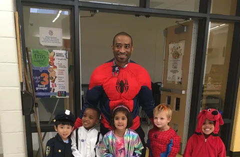 Chef reggie dressed a spiderman with little kids