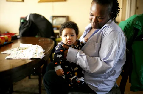 Woman with baby on arms