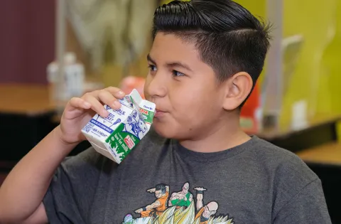 Student enjoys a healthy school meal.