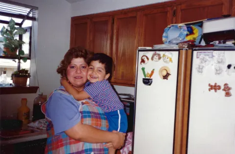 Woman with kid in arms. old photo