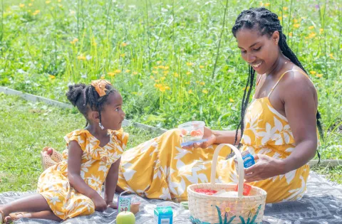Mom and daughter having a picnic