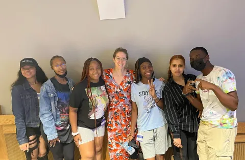 Group of 6 youth Black teenagers with a white woman