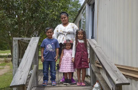 Family mom and three kids in porch