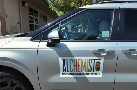 Car with logo of Alchemist CDC