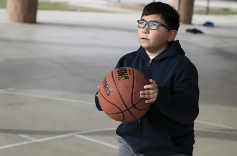 Oliver playing basketball