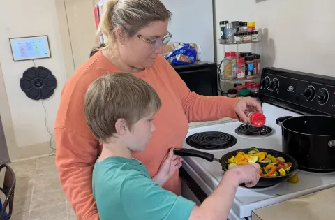 Family cooking at home (white mom and son)