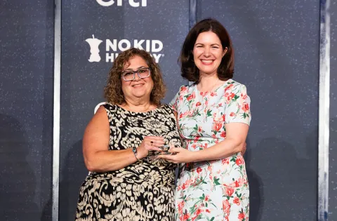 Anne (white woman) photo with a food service director (white woman)