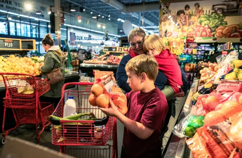 Family shopping at grocery store